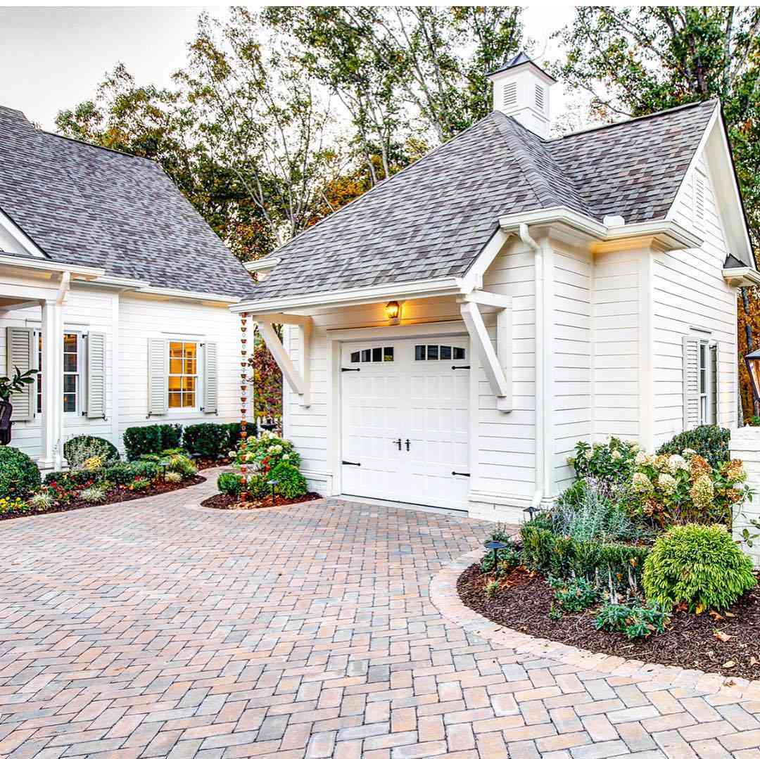 small white shingled garage