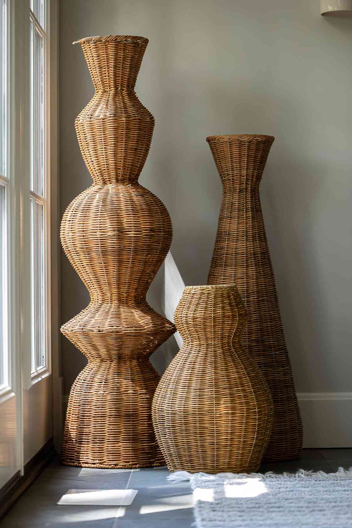 woven sculptural baskets in corner