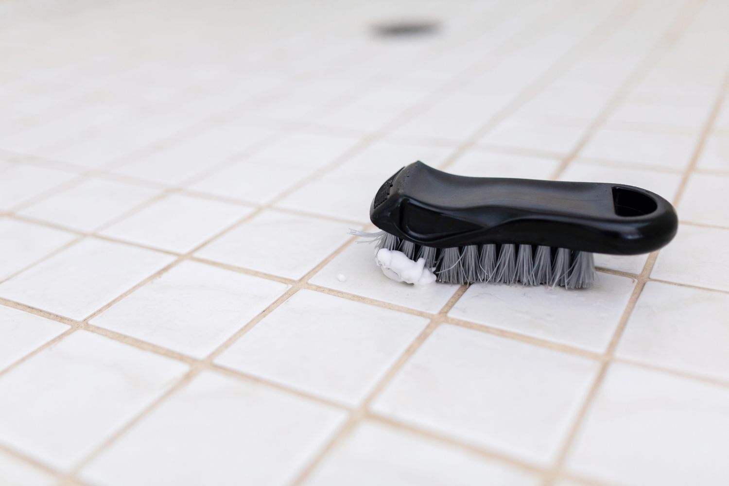 scrub brush on ceramic tile