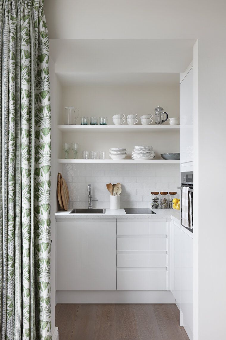 textured tile backsplash with white cabinets