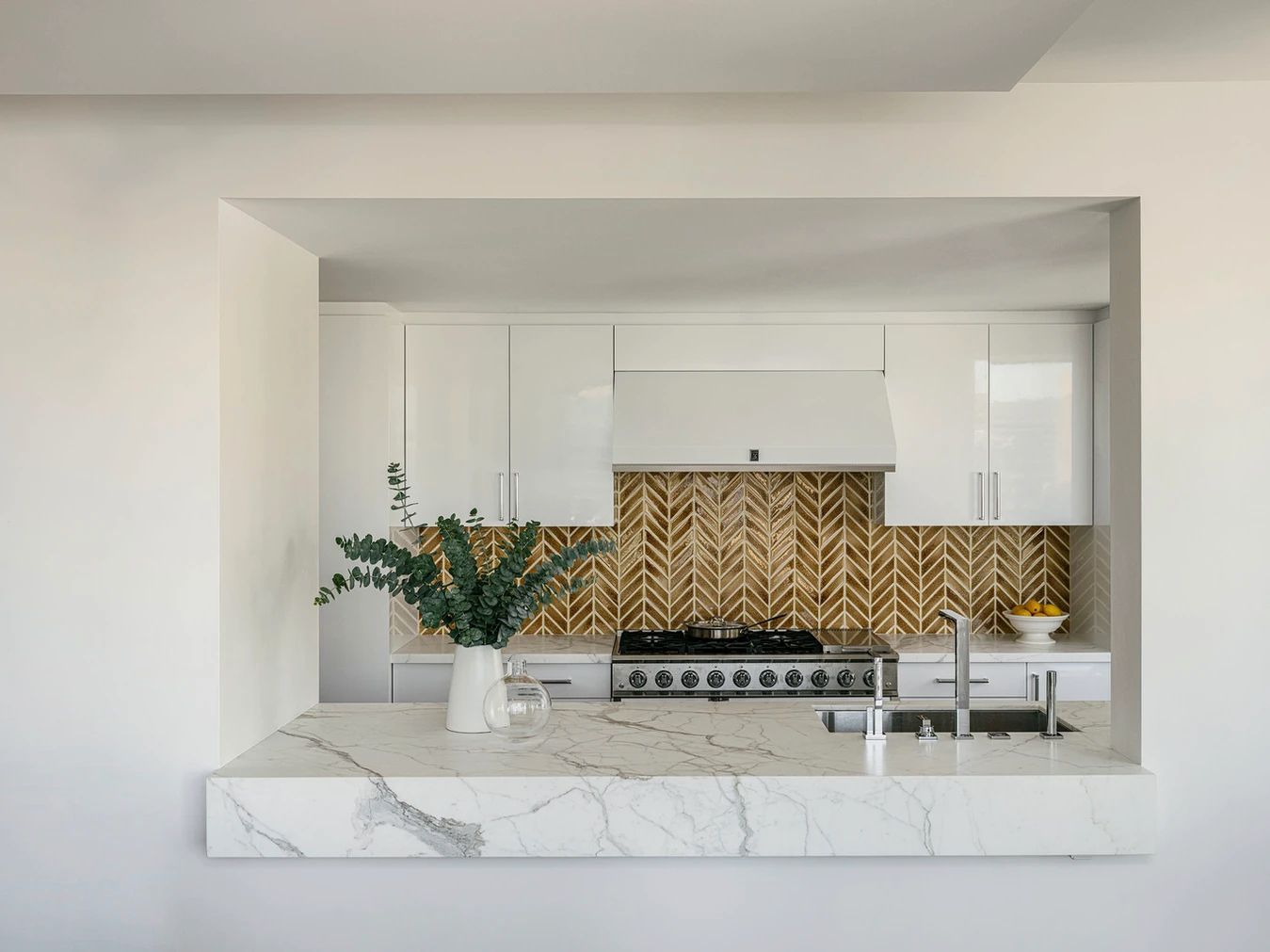 earth tone backsplash white cabinets