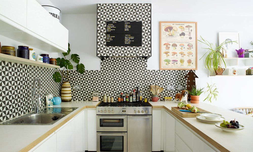 black and white backsplash with white cabinets