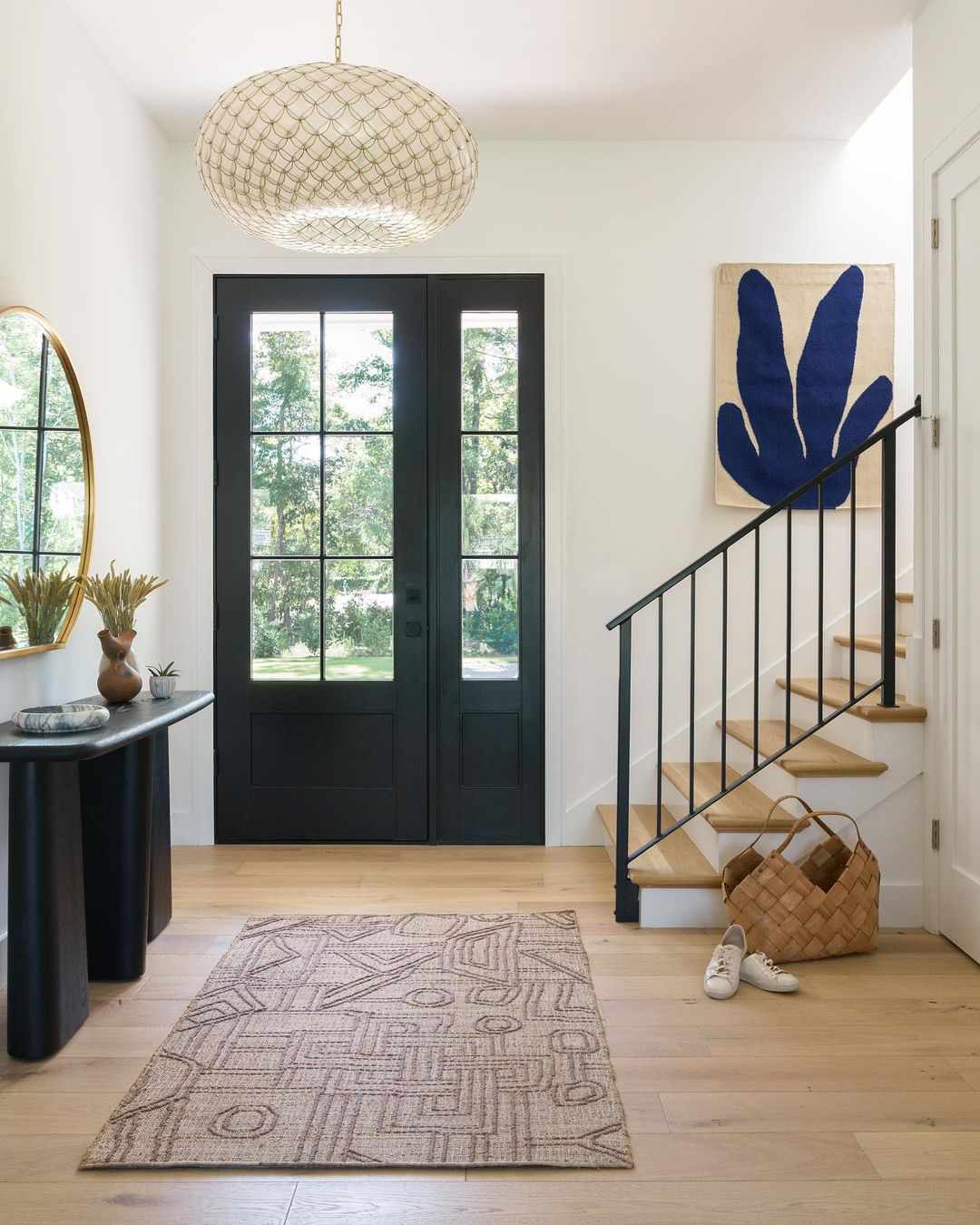 Stylish entryway with bold light fixture.