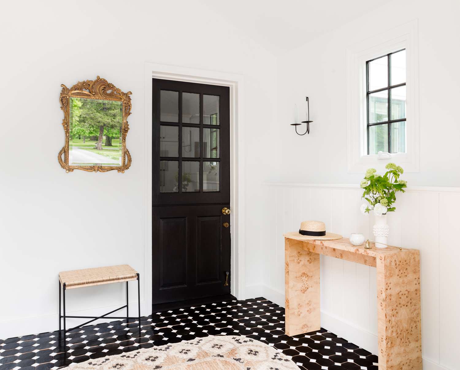 entryway with mounted taper candles.