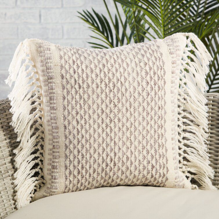 chic neutral tassle pillow