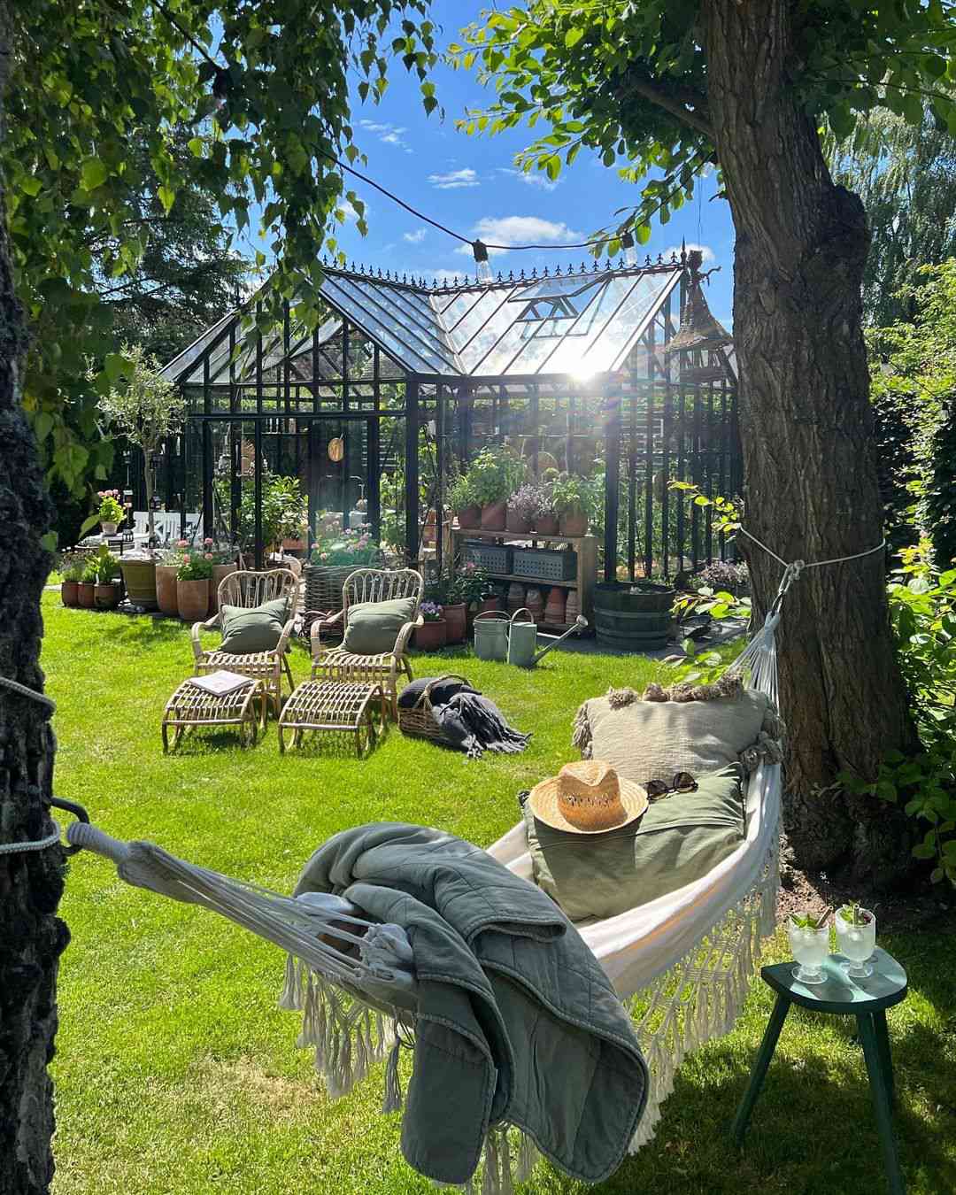 Cozy Hammock, Lounge Chairs, and Greenhouse In Garden