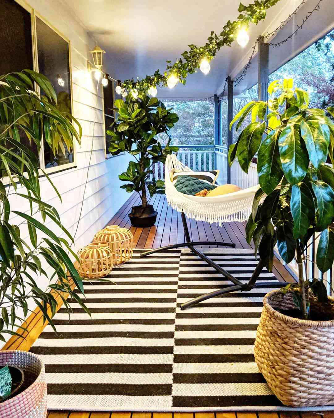 Deck Decorated With A Hammock And Plants