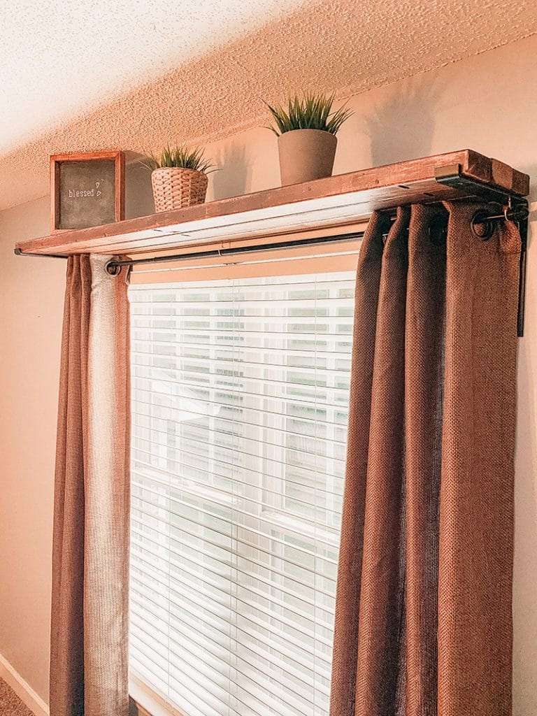 A DIY curtain rod with a shelf