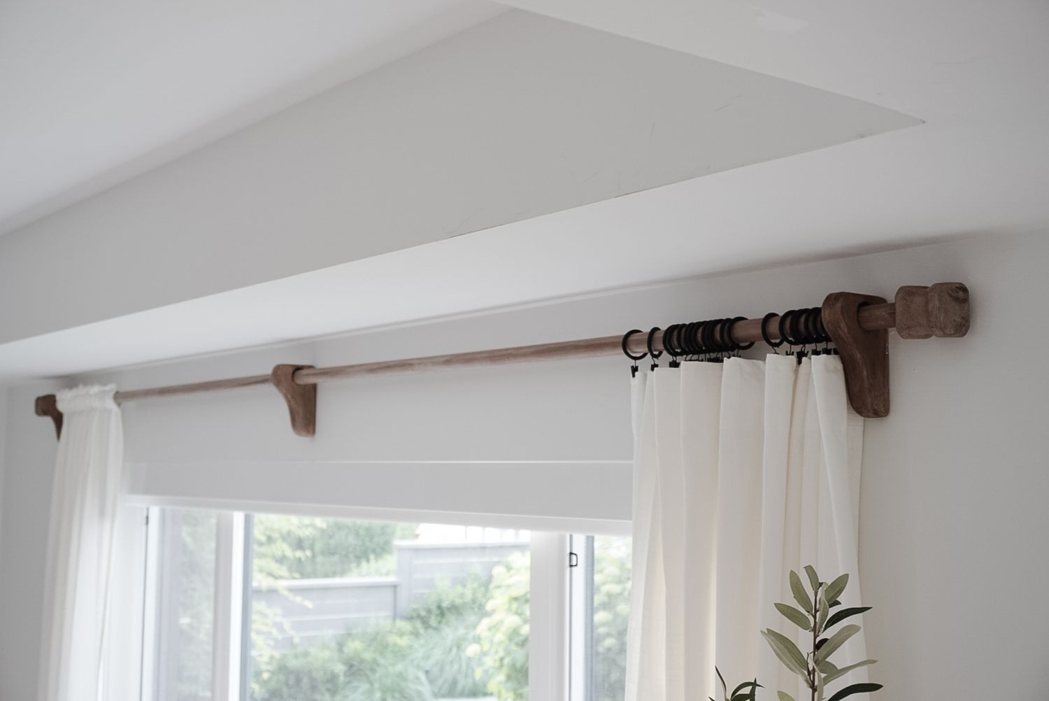 A rustic DIY curtain rod