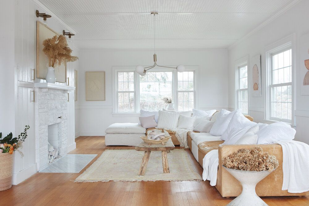 glossy white shiplap fireplace wall