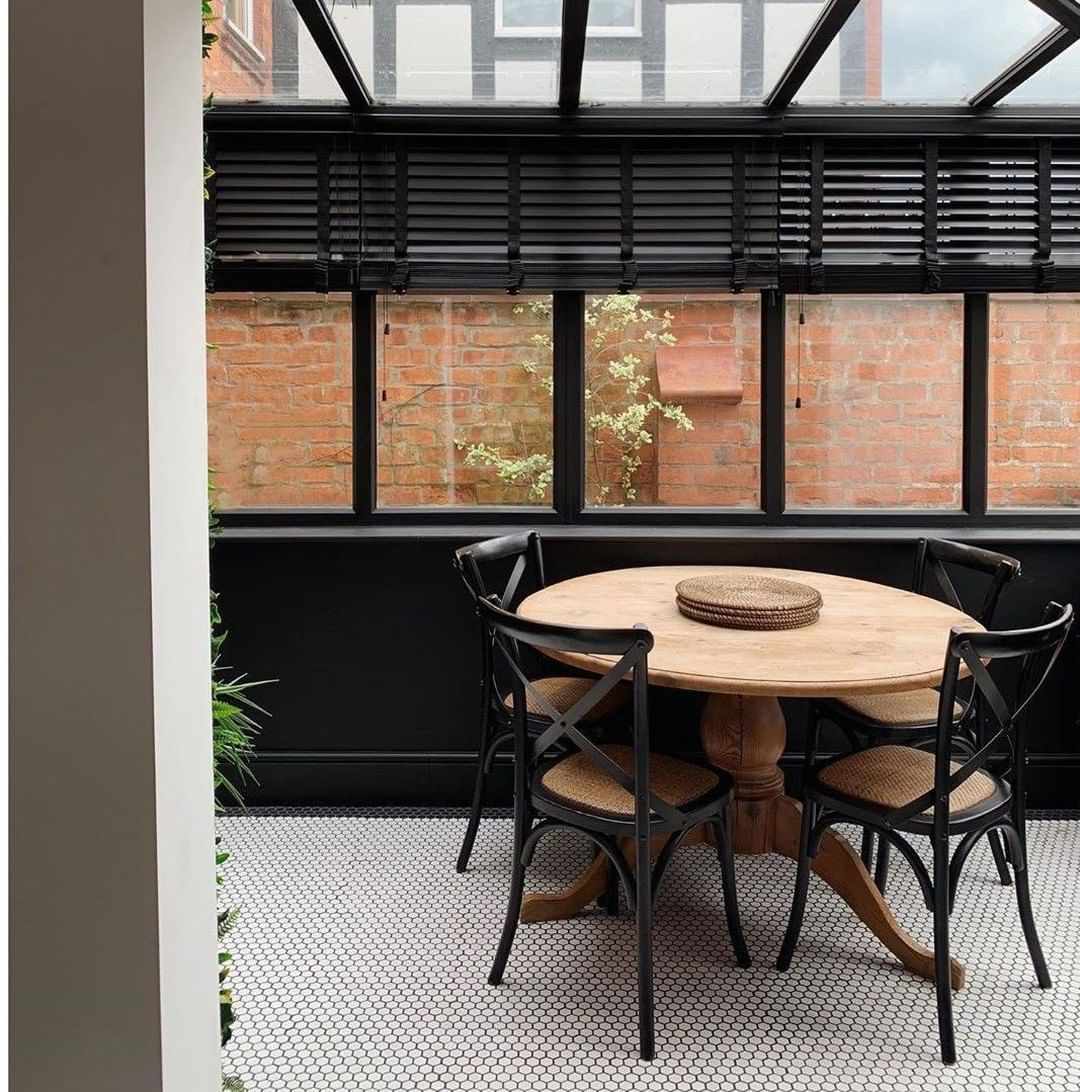 black sunroom dining room