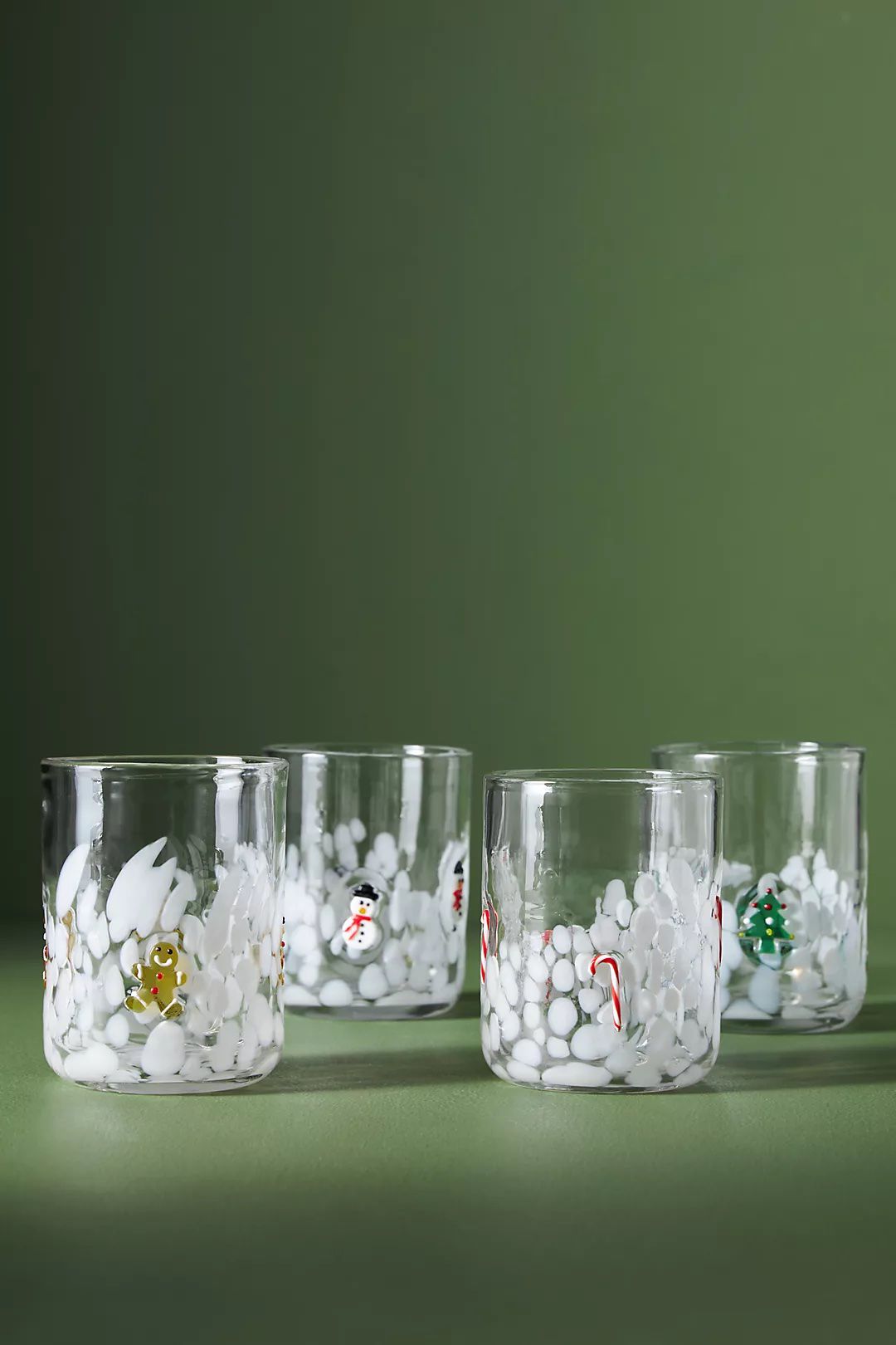 Set of four holiday themed glasses