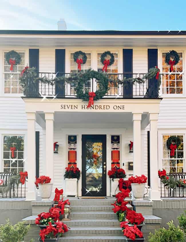 second story house balcony decorated for christmas