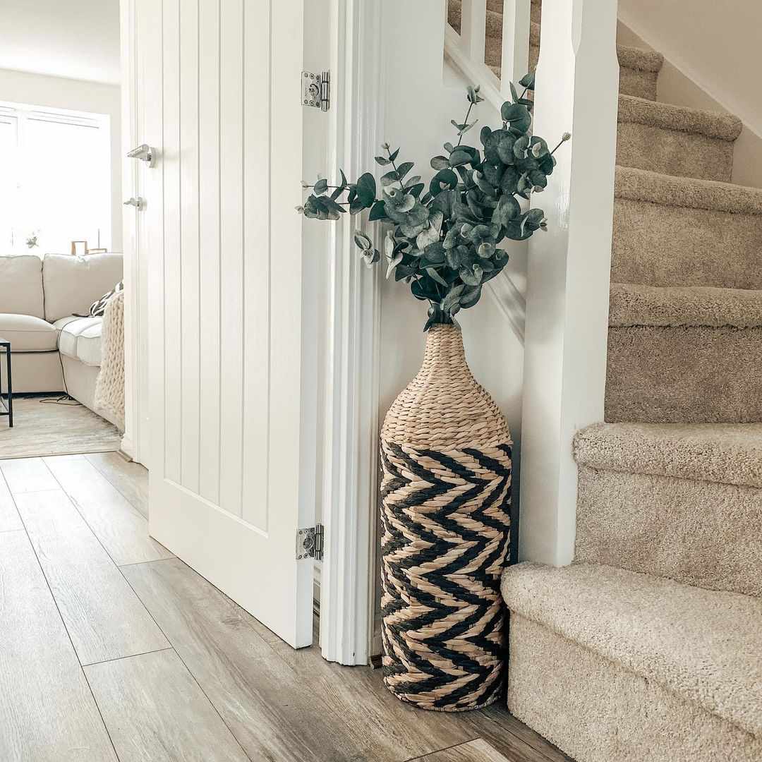 woven vase in stairway