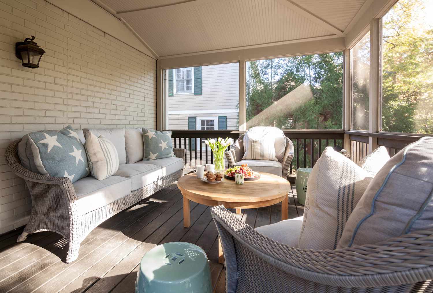Screened in porch with rotan seating arrangement