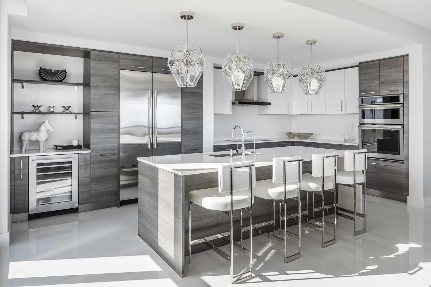 An all-gray kitchen has gray floors, gray cabinets, and a gray island
