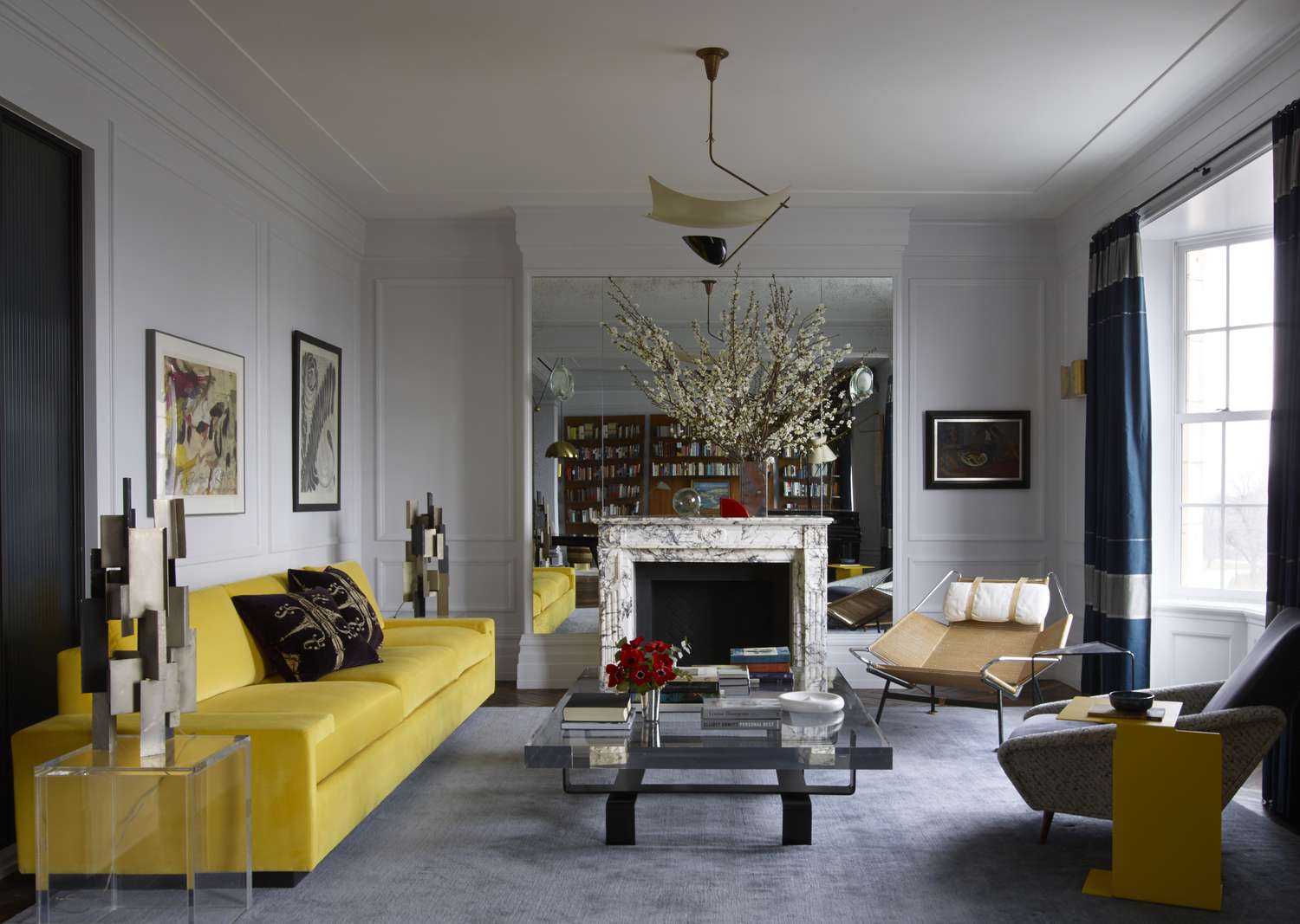 yellow sofa and gray rug in formal living room