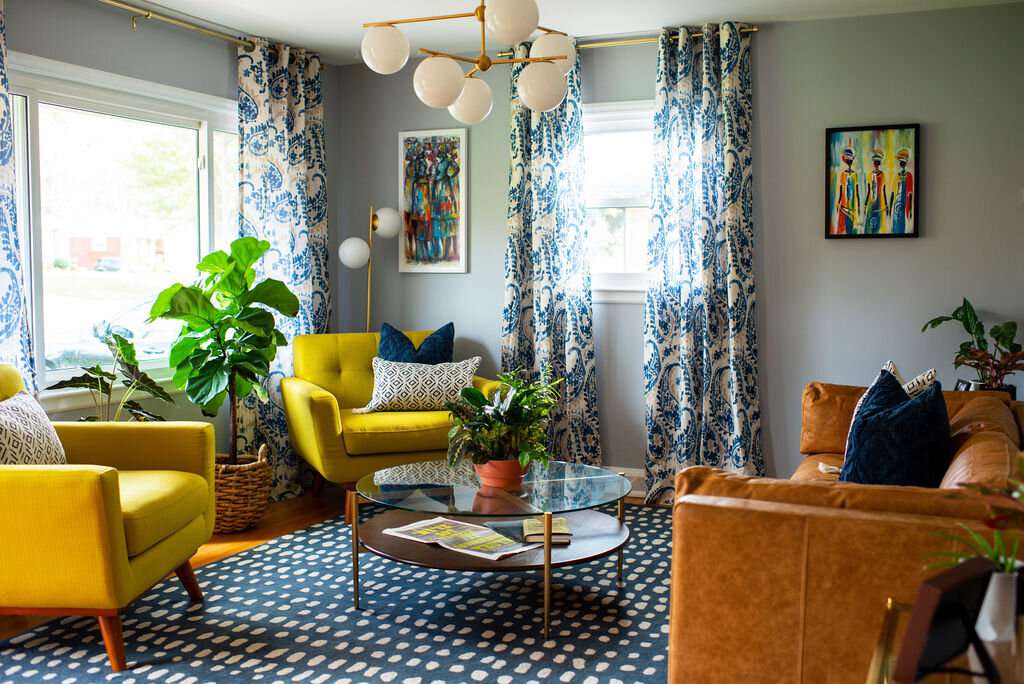 gray walls and bright yellow chairs