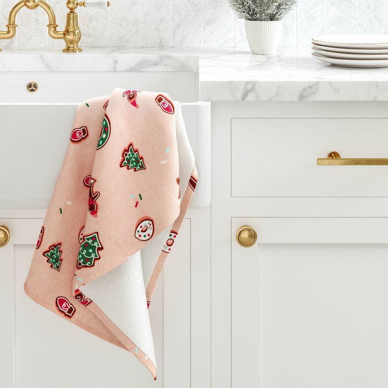 Target's Christmas Cookies kitchen towel displayed against a white kitchen sink
