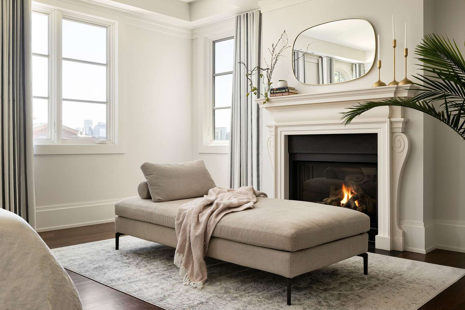 chaise by fireplace