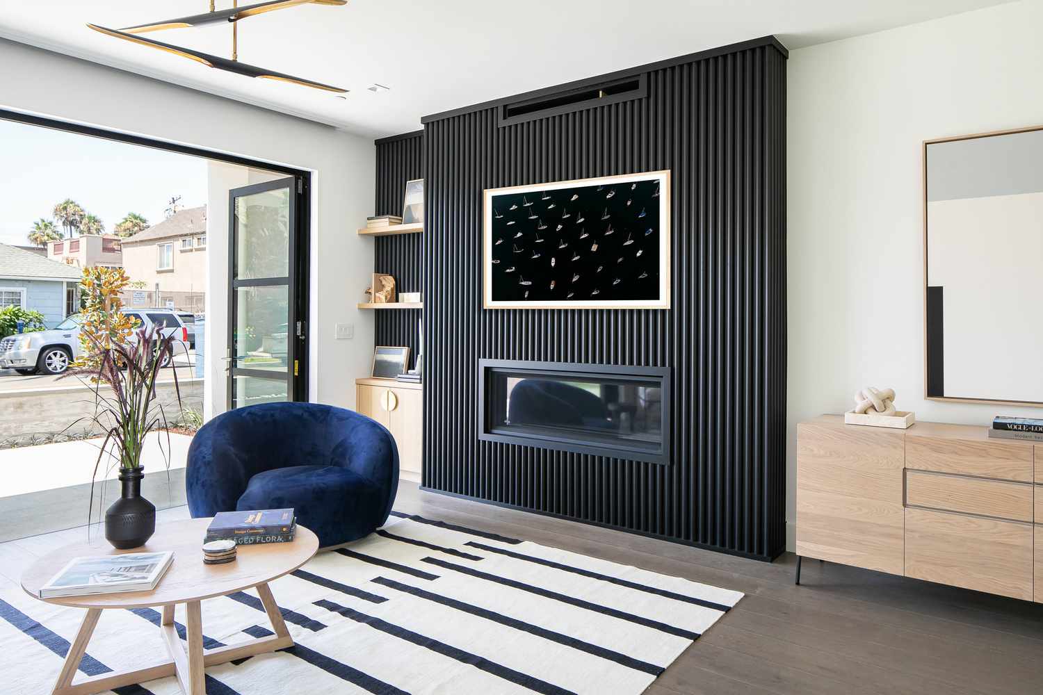 modern black wood slat fireplace wall