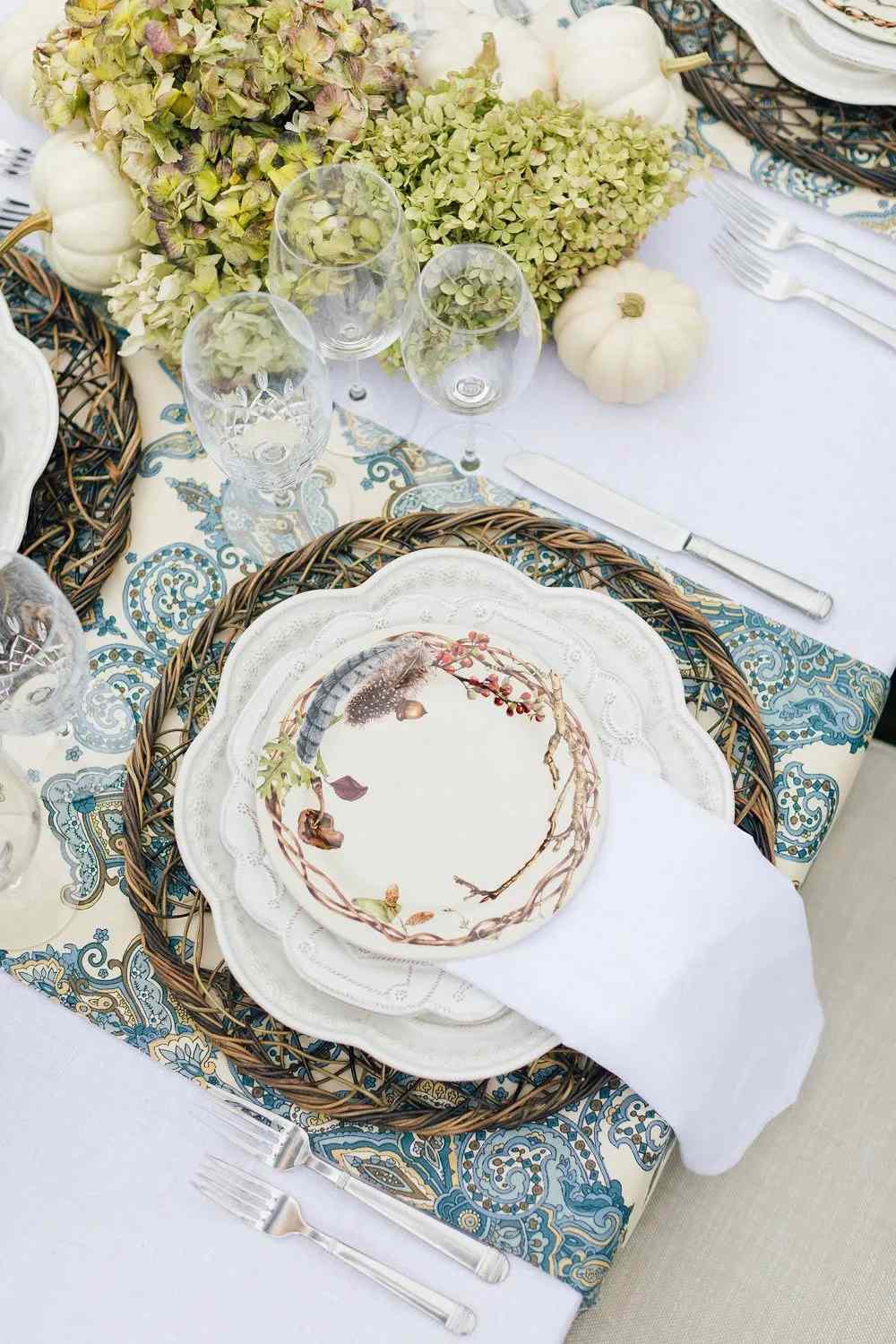 Close-up of an elegant blue and white autumn place setting