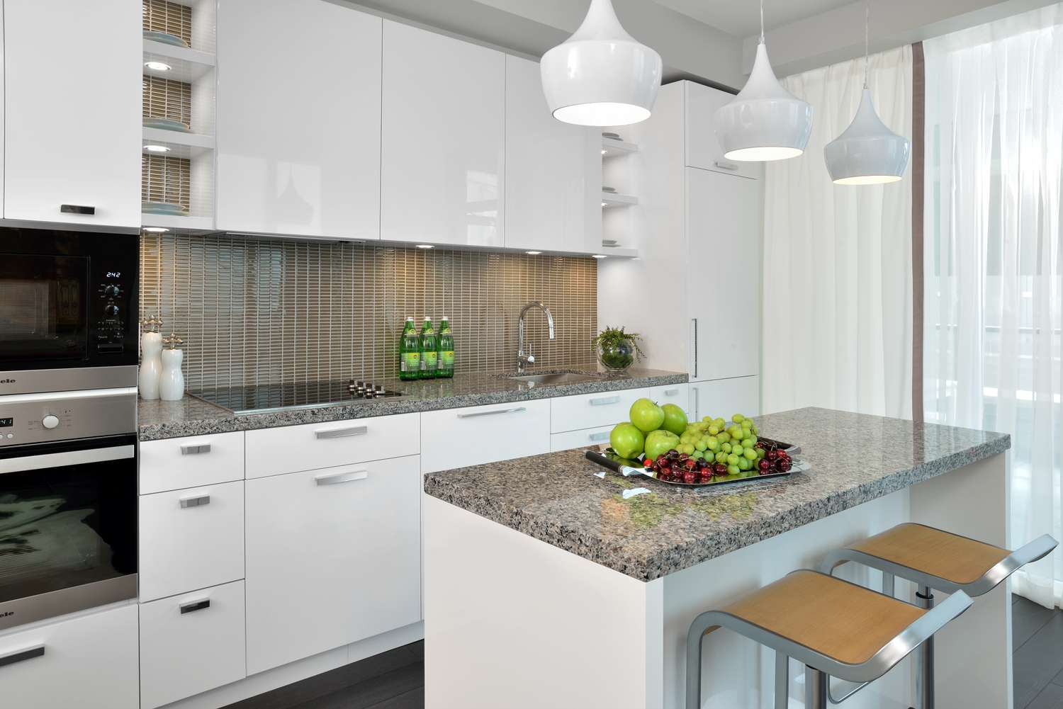 granite countertop and gray backsplash