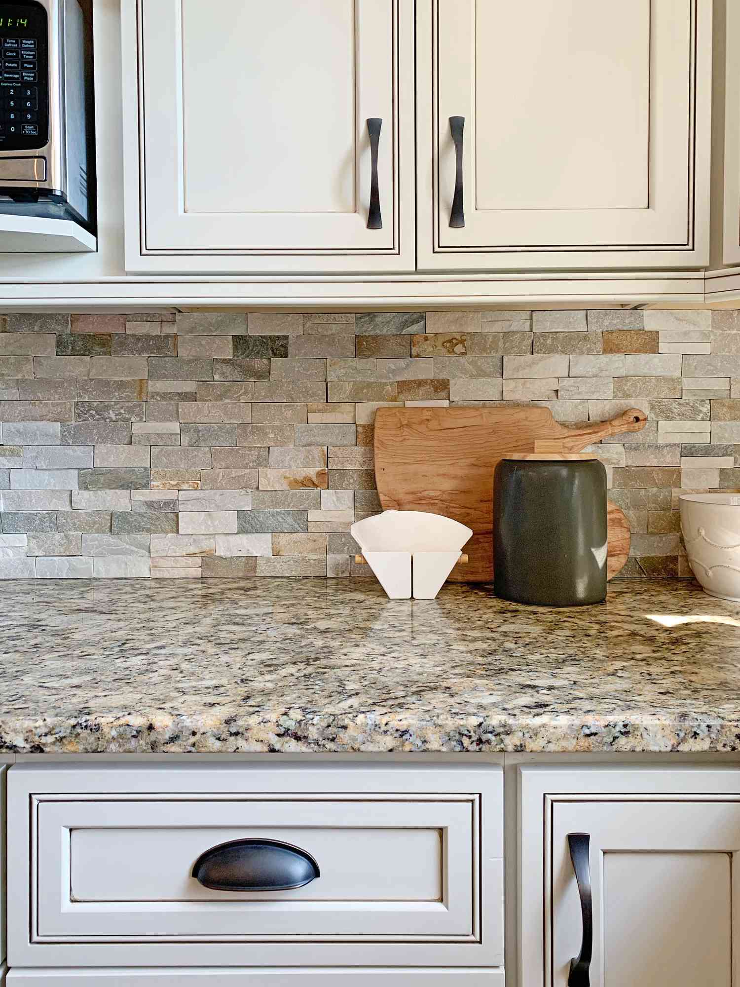 granite countertops and stone backsplash