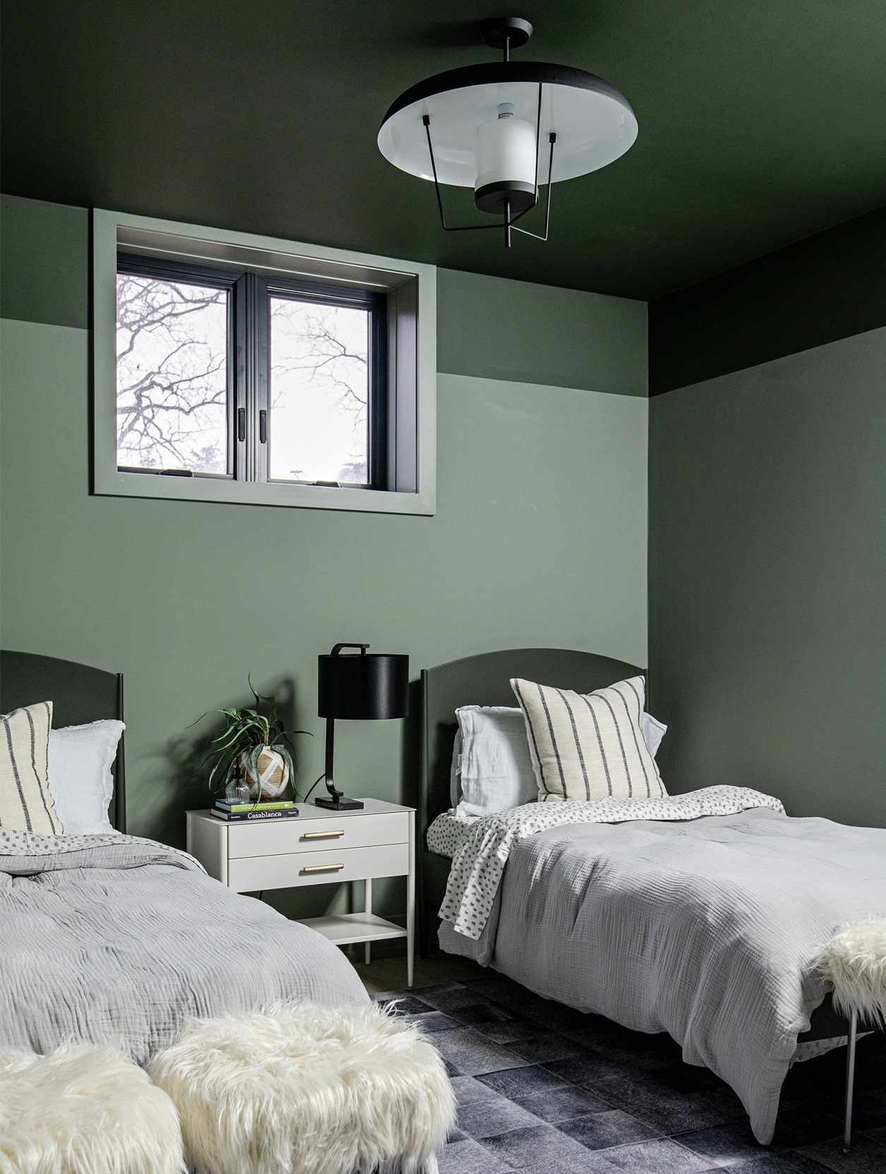 Dark green ceiling in a room with green walls
