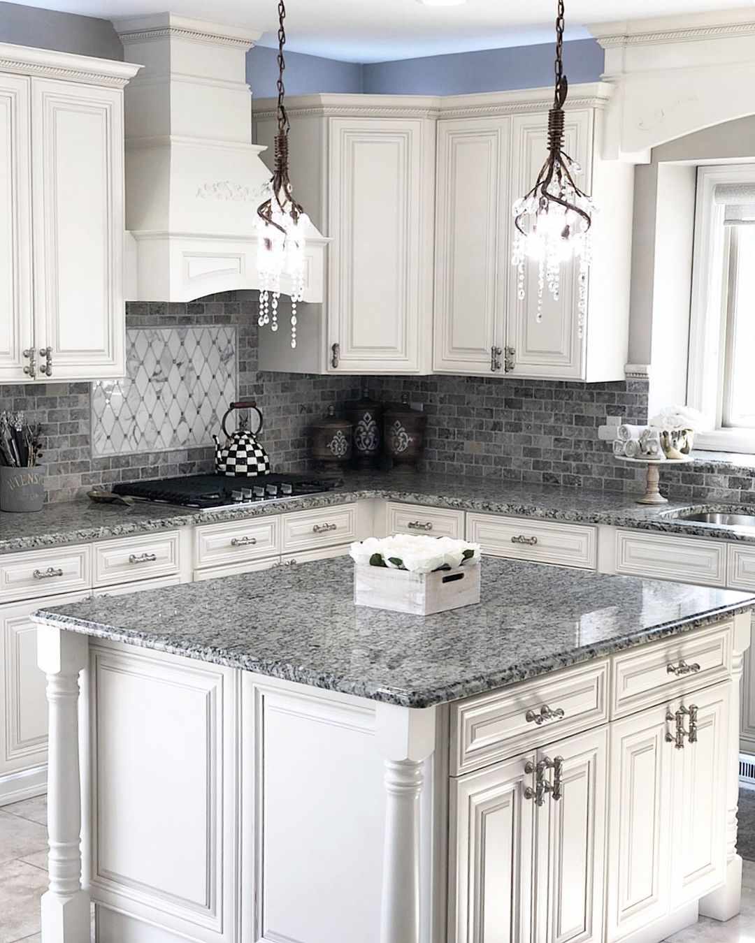 granite counters and small tile backsplash