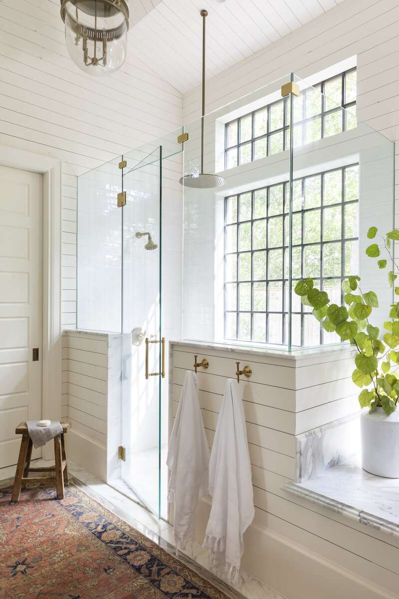 bathroom half wall with towel hooks