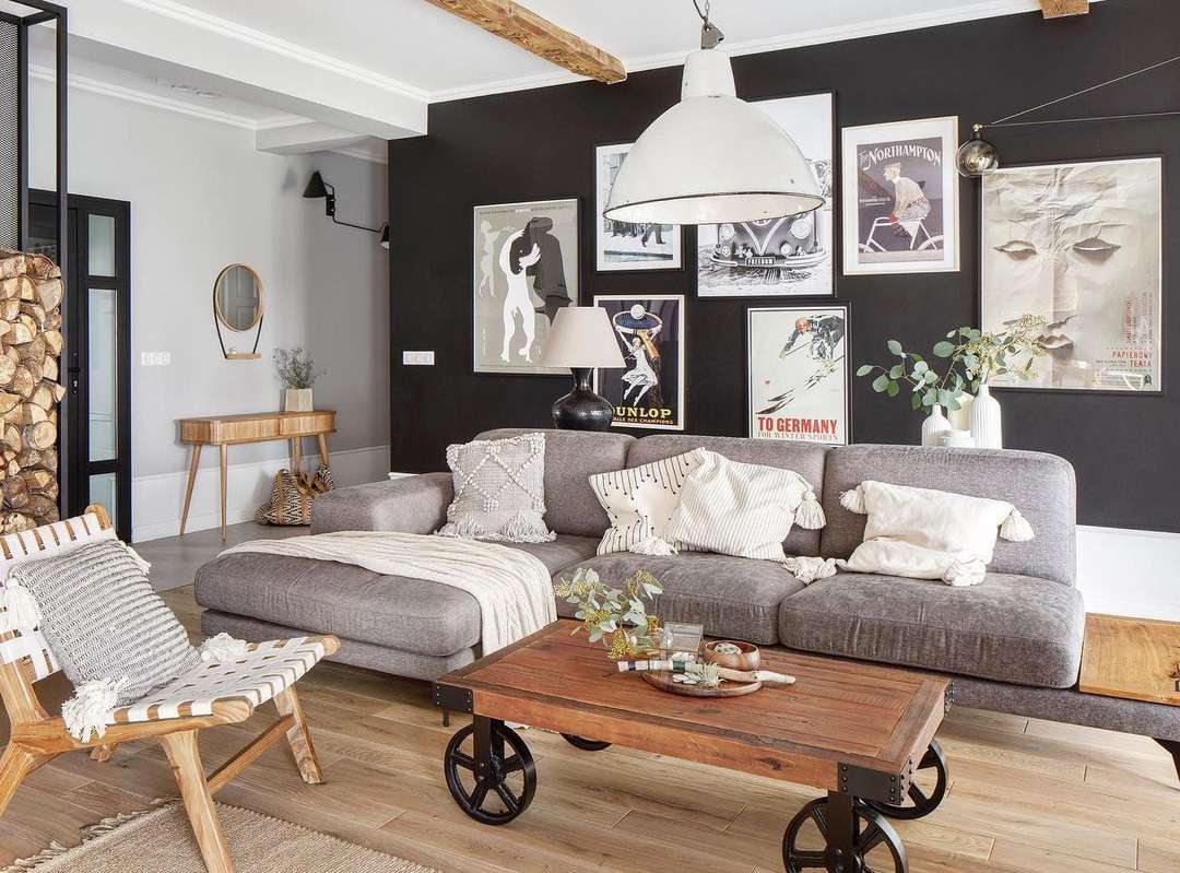 black accent gallery wall with eclectic prints and decor