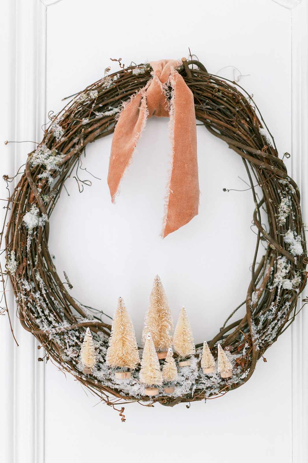 A DIY wreath featuring bottle brush trees