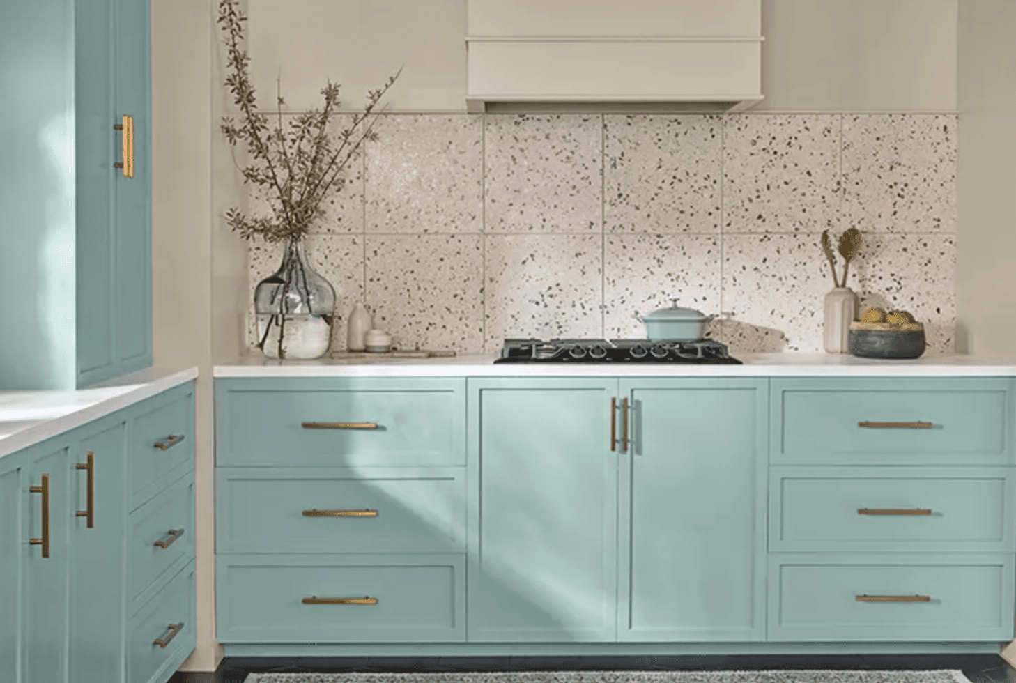 teal kitchen with cream hood