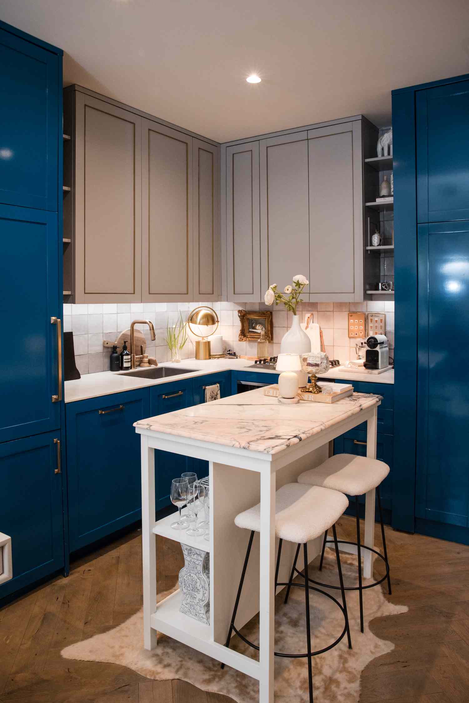 blue cabinets with tile backsplash