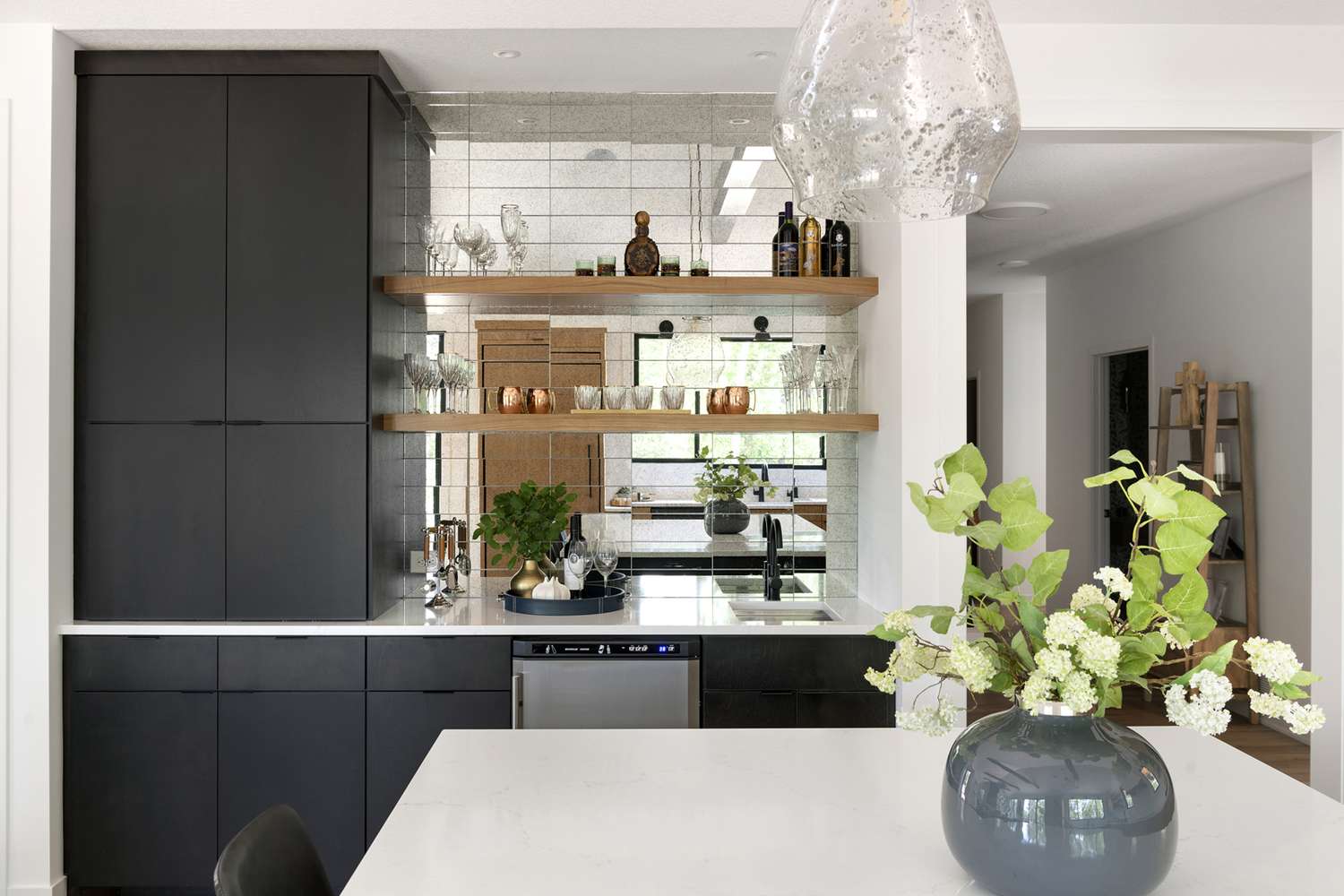 black cabinets and mirrored design