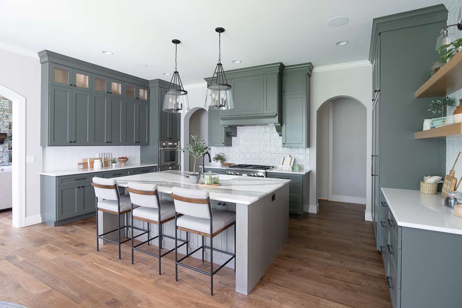 gray green cabinets and white backsplash