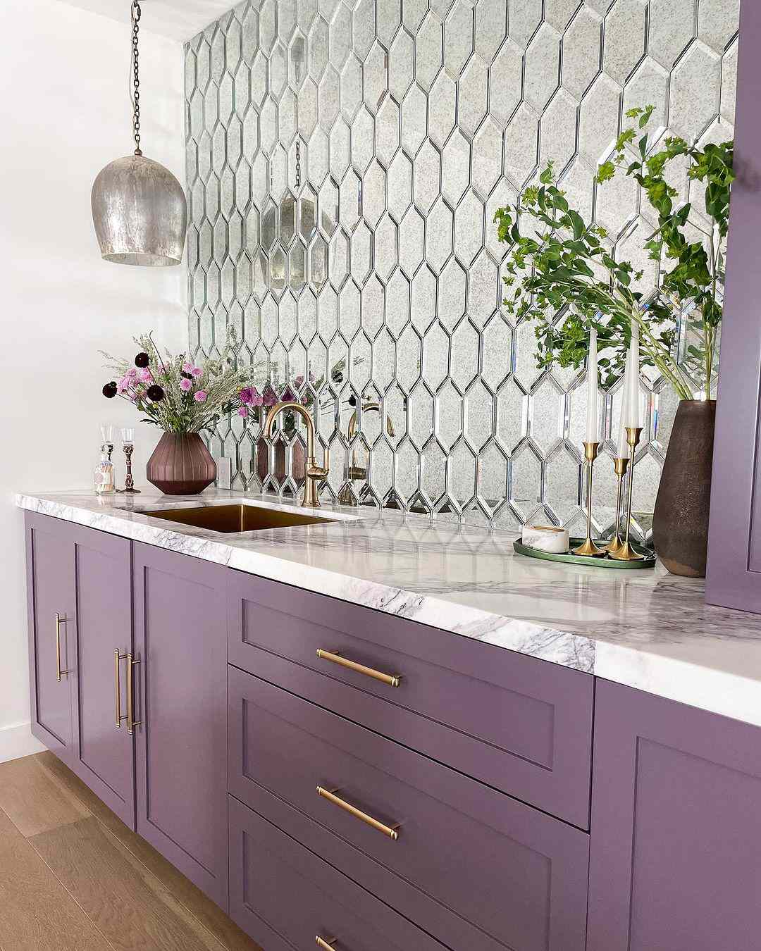 purple countertops and mirrored backsplash