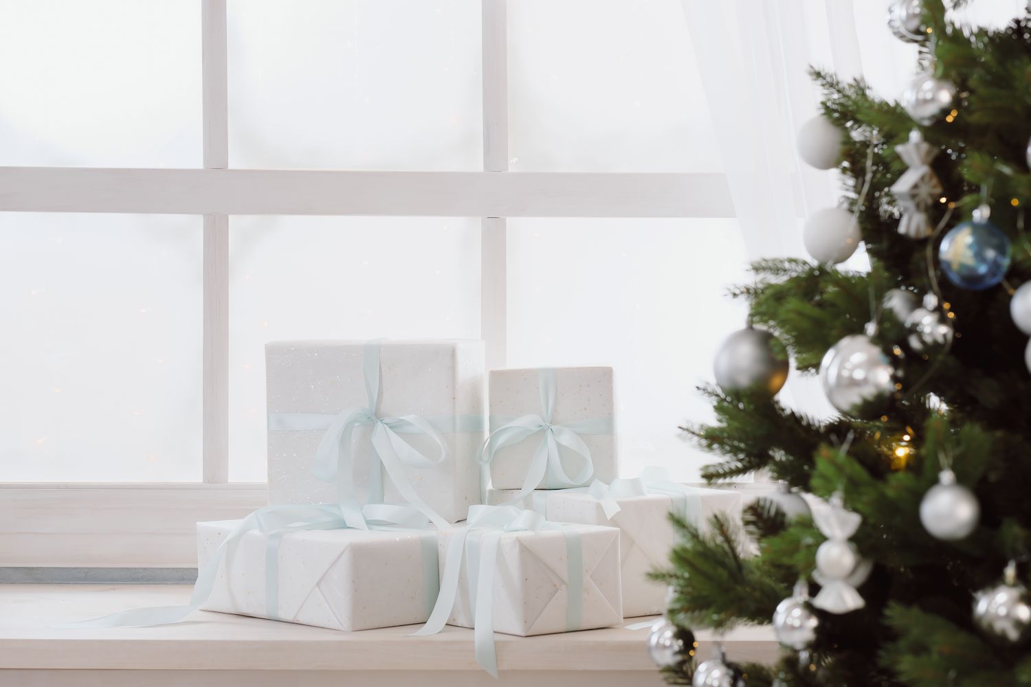 white wrapped presents on windowsill