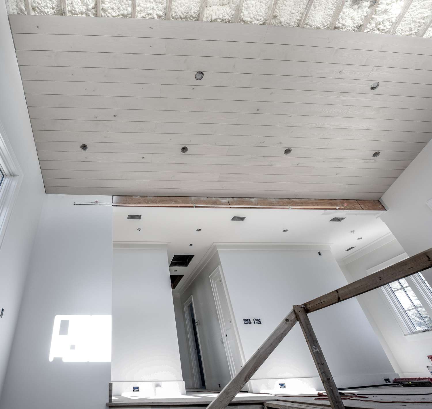 Beadboard being installed on a ceiling