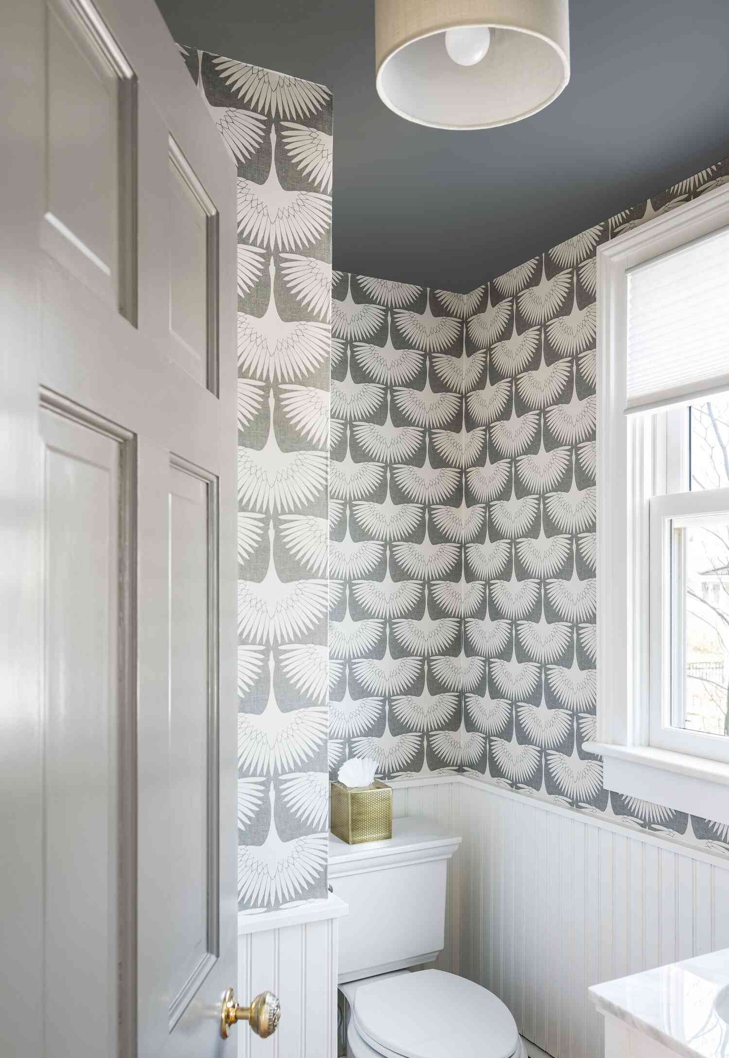 bathroom wainscoting with wallpaper