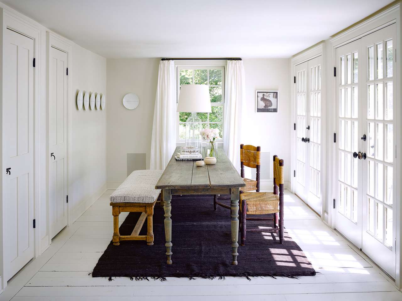 modern farmhouse dining room with plates on the wall