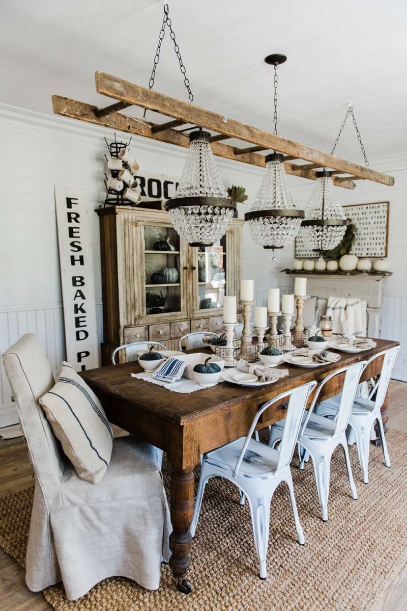 modern farmhouse dining room with vintage signs