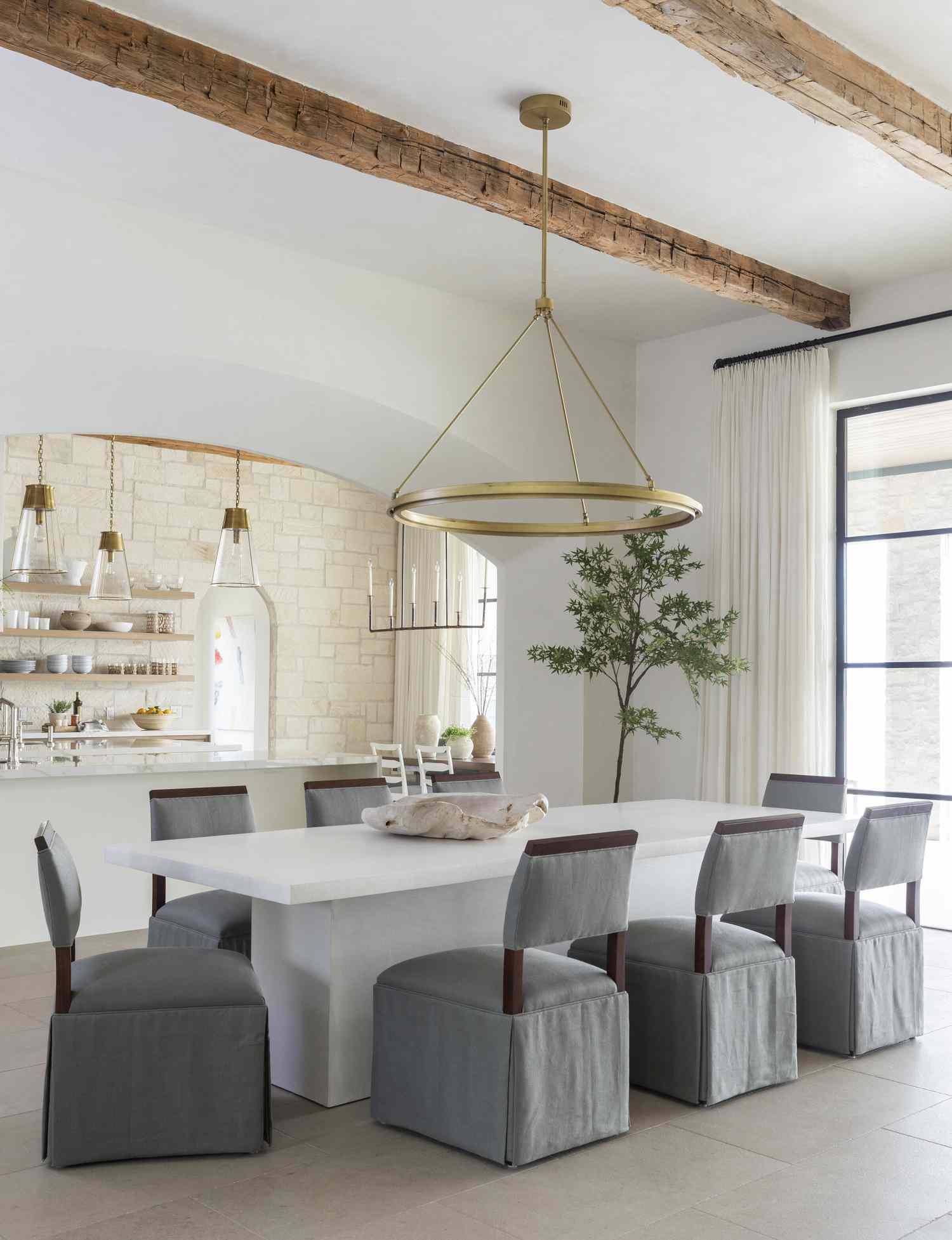 modern farmhouse dining room with rustic beams