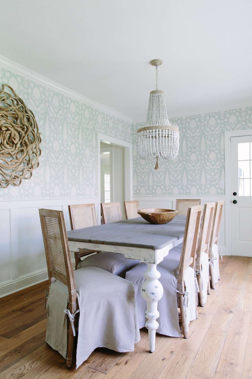 modern farmhouse dining room with beaded chandelier