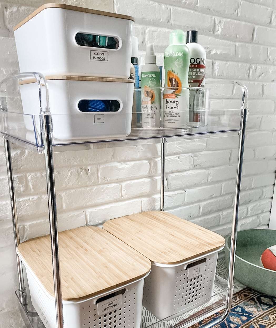 Acrylic cart with organized dog supplies, food, and treats