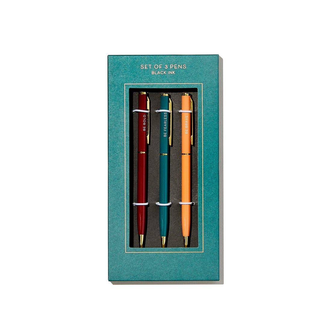 conjunto de três canetas em uma embalagem azul-petróleo