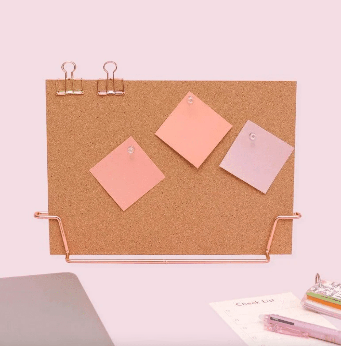 cork board on pink background