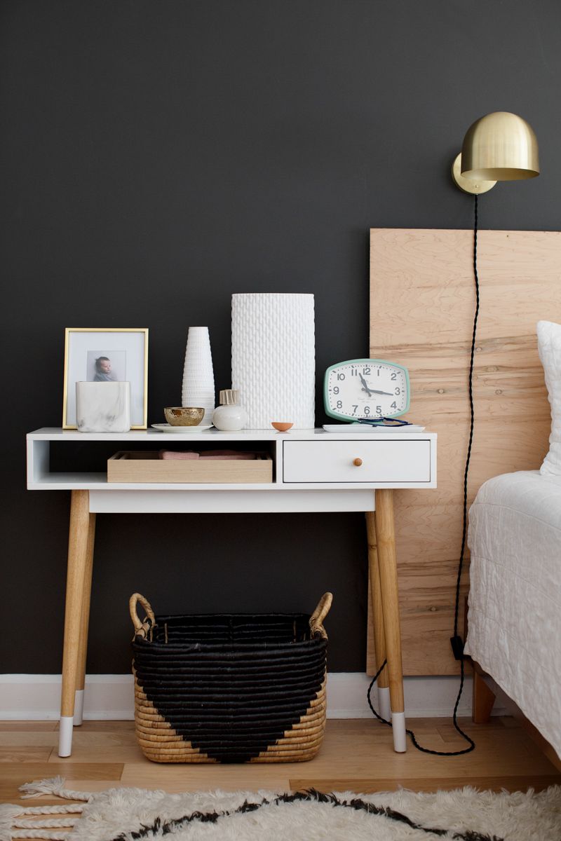 black accent wall wood headboard bedroom