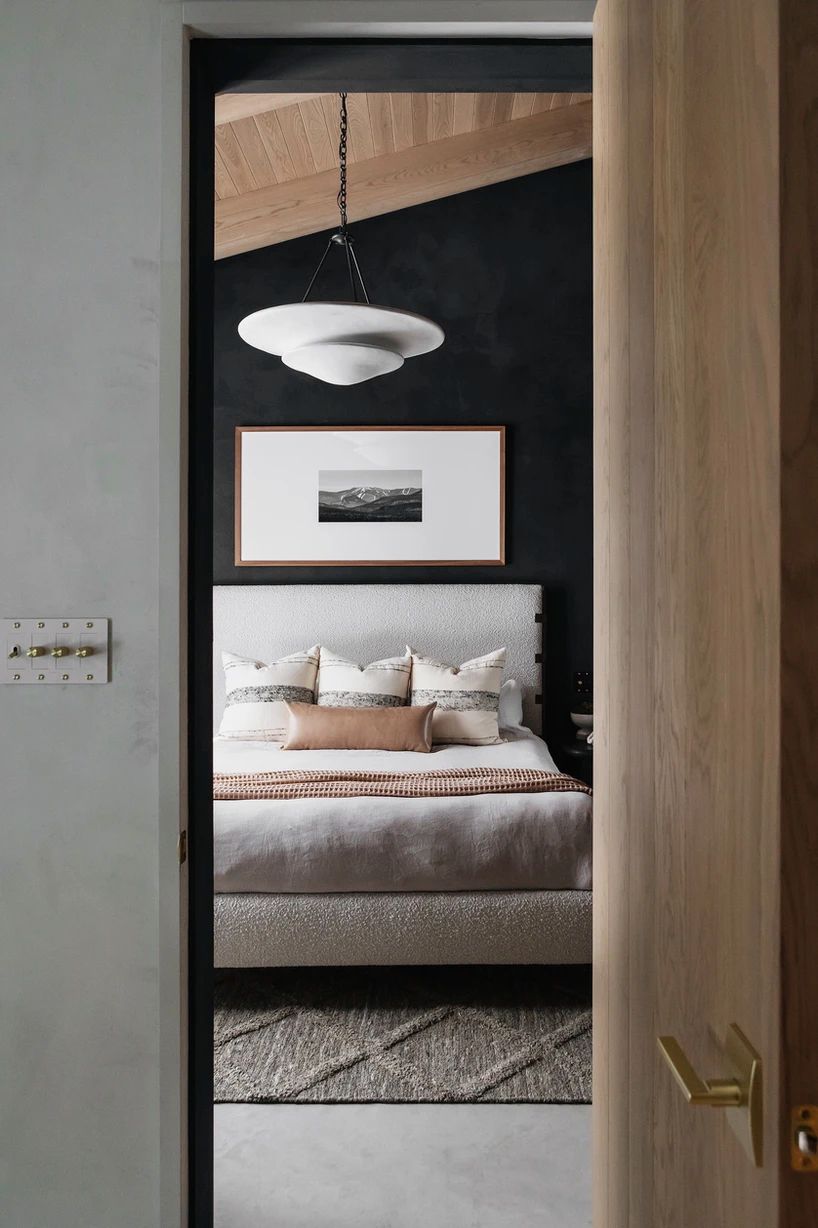black accent wall wood ceiling bedroom